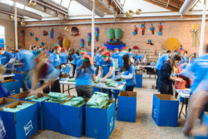 SPREADING JOY: Hasbro Inc. employees each holiday season wrap and deliver toys and games to children and families. / PBN PHOTO/RUPERT WHITELEY