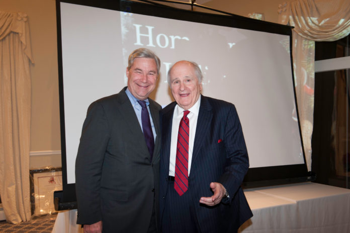 JOHN M. MURPHY, right, founder of Home Loan Investment Bank, celebrates his retirement with U.S. Sen. Sheldon Whitehouse. / COURTESY HOME LOAN INVESTMENT BANK