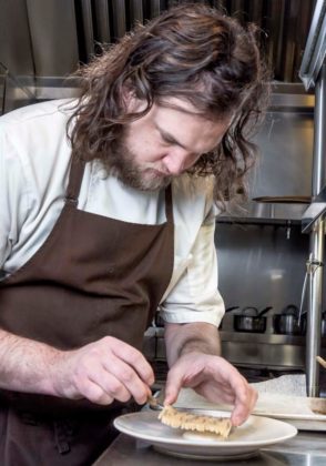 TOP CHEF: Ben Sukle, executive chef and owner of Birch, located at 200 Washington St. in Providence, plates Birch's Raw Kohlrabi. He also owns Oberlin, recently recognized by Bon App&eacute;tit magazine. / PBN FILE PHOTO/MICHAEL SALERNO