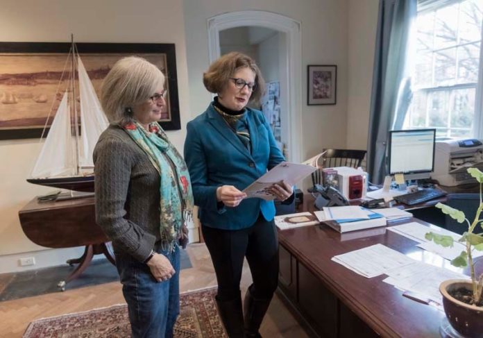 SERIOUS BUSINESS: Morgan Grefe, right, executive director of the R.I. Historical Society, meets with Mary Lou Upham, membership officer. / PBN PHOTO/ MICHAEL SALERNO