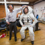 Five Questions With: Michael Lye RHODE ISLAND School of Design professor Michael Lye is shown with astronaut Andrzej Stewart, who is wearing a Mars simulation spacesuit that was created in Lye’s class. / COURTESY JO SITTENFELD/RISD