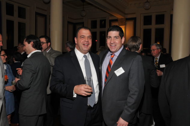 CHRISTOPHER SANTILLI, corporate development officer at Roger Williams University, on left, is shown with Stephen Ucci, counsel for Adler, Pollock and Sheehan P.C., at the Providence Business News' Book of Lists party at the Providence Public Library on Thursday night. / PBN PHOTO/,IKE SKORSKI