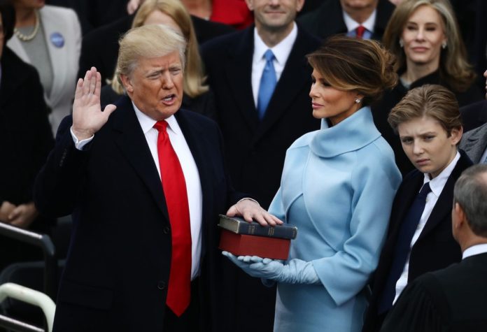 DONALD J. TRUMP WAS SWORN IN as the 45th president of the United States on Friday. Next to him is his wife, Melania. / BLOOMBERG NEWS PHOTO