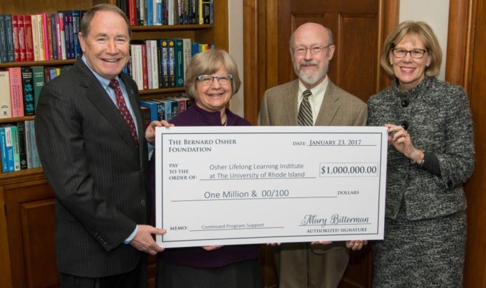 FROM LEFT TO RIGHT, University of Rhode Island President David Dooley, URI Institute Executive Director Beth Leconte, URI Professor Phillip G. Clark and URI Foundation President Lil Breul O’Rourke are shown with the check from The Bernard Osher Foundation for $1 million. / COURTESY UNIVERSITY OF RHODE ISLAND