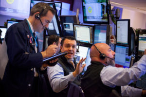 TRADERS WORK on the floor of the New York Stock Exchange in New York City. The Dow Jones Industrial Average climbed past 20,000 for the first time as stocks around the world extended a rally after corporate earnings reignited investors’ optimism in economic growth. Bonds sold off with oil. / BLOOMBERG NEW PHOTO/MICHAEL NAGLE