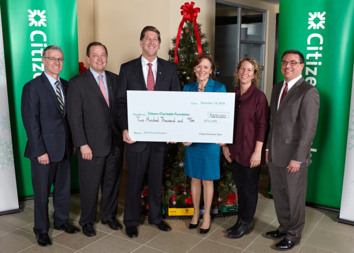 FROM LEFT, Citizens Bank officials Brad Conner, vice chairman, consumer banking, and Don McCree, vice chairman, commercial banking, join Bruce Van Saun, Citizens chairman and CEO; Barbara Cottam, chair of Citizens Charitable Foundation; Sasha Purpura of Food for Free; and David Caprio of Children’s Friend and Service at a Dec. 14 ceremony in Boston marking the $200,000 donation to the Citizens Charitable Foundation. / COURTESY CITIZENS BANK