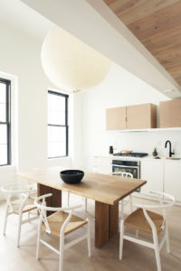 EUROPEAN FLAVOR: Eat-in kitchens are equipped with white oak European cabinets, stainless-steel appliances, concealed range hoods and Corian counters, and finished with matte black Brizo fittings. / COURTESY ASH NYC