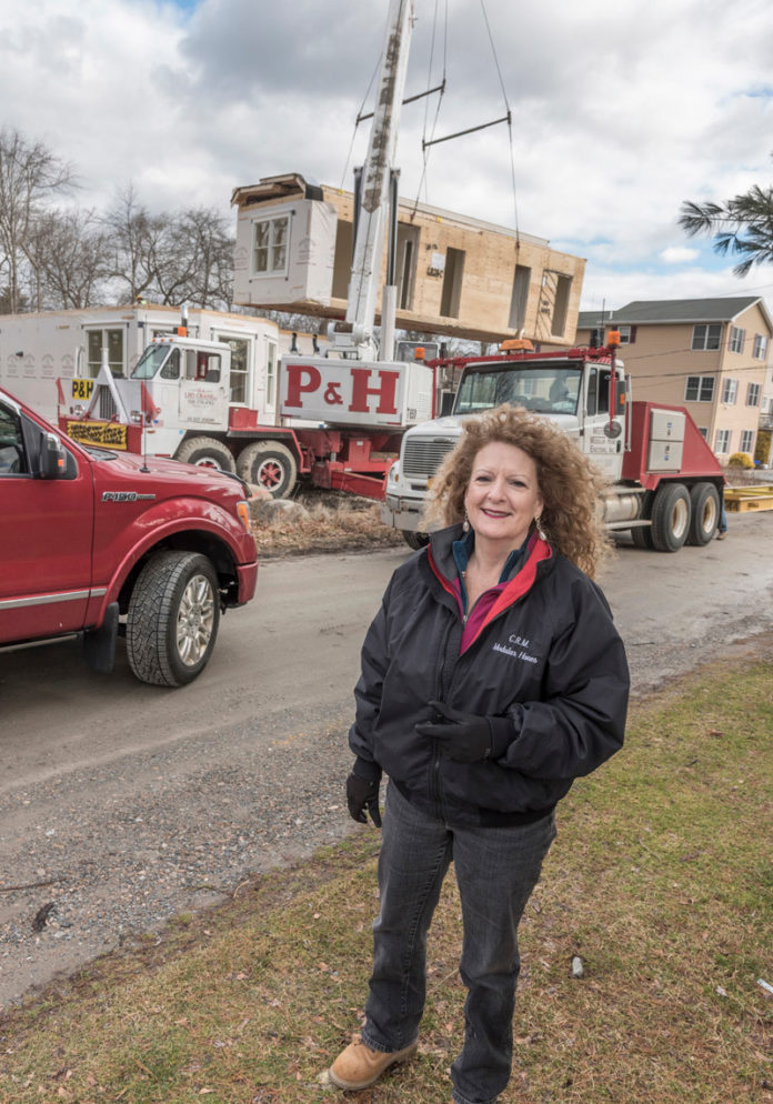 NEW HOMES: Carol O'Donnell, owner of CRM Modular Homes, on-site at an installation in Narragansett. / PBN PHOTO/ MICHAEL SALERNO