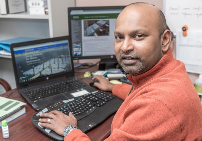 TECH TANDEM: A $29,000 Innovation Voucher was won by Newport-based PowerDocks LLC and Roger Williams University to help build renewable-energy marine charging stations. Charles Thangaraj, RWU assistant professor of engineering, will head research for  the project. / PBN PHOTO/ MICHAEL SALERNO