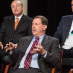 Saying what he thinks for effect IN THE MIDDLE OF THE CONVERSATION: Rhode Island Foundation President and CEO Neil D. Steinberg took part in Providence Business News' 30th Anniversary business-leader roundtable. In background are Kahn, Litwin, Renza & Co. Managing Director Alan H. Litwin, left, and MojoTech founder and CEO Nick Kishfy. / PBN FILE PHOTO/RUPERT WHITELEY