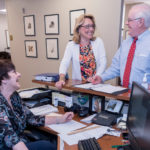 FUN PLACE TO WORK: Among PBN's 2016 Best Places To Work was the Providence law firm Robinson & Cole. From left, Brenda L. Vucci, legal administrative assistant; Heidi K. Seddon, legal administrative assistant; and Peter V. Lacouture, partner, share a laugh at the firm's office. / PBN FILE PHOTO/MICHAEL SALERNO