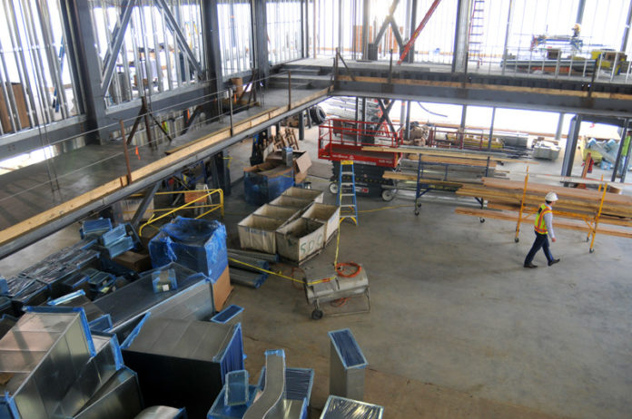 BUILDING ON PERFORMANCE: Moses Brown School in early December was preparing to open its Woodman Community & Performance Center, a 33,000-square-foot facility to serve as both a community and performing arts hub. It was designed by DBVW Architects and built by Dimeo Construction Co. / PBN FILE PHOTO/FRANK MULLIN BUILDING ON PERFORMANCE: Moses Brown School in early December was preparing to open its Woodman Community & Performance Center, a 33,000-square-foot facility to serve as both a community and performing arts hub. It was designed by DBVW Architects and built by Dimeo Construction Co. / PBN FILE PHOTO/FRANK MULLIN