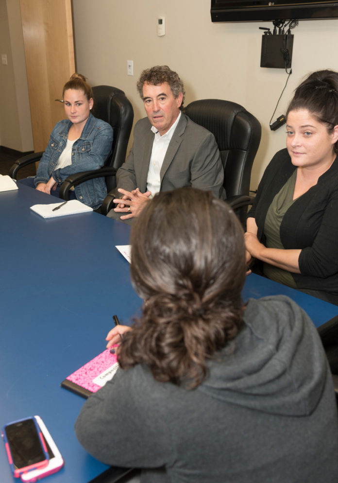PULLING TOGETHER: Child & Family CEO and President Marty Sinnott looks to apply national best practices and break down traditional silos in Rhode Island, starting with his own organization. From left, Lauren Silveria, clinical intern; Kara Aniballi, residential clinician, Girard House; and Juliana Lau, residential clinician. / PBN FILE PHOTO/MICHAEL SALERNO PULLING TOGETHER: Child & Family CEO and President Marty Sinnott looks to apply national best practices and break down traditional silos in Rhode Island, starting with his own organization. From left, Lauren Silveria, clinical intern; Kara Aniballi, residential clinician, Girard House; and Juliana Lau, residential clinician. / PBN FILE PHOTO/MICHAEL SALERNO