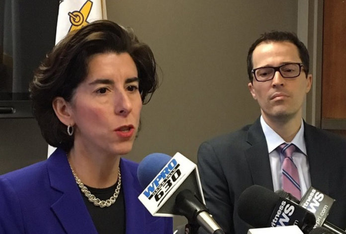 NEXT STEPS FORWARD: Gov. Gina M. Raimondo, flanked by Acting Director of the Department of Human Services Eric J. Beane, delivers the summary of a 30-day review of the flawed rollout of the state's UHIP system, including what steps the state will take going forward. / PBN PHOTO/EMILY GOWDEY-BACKUS