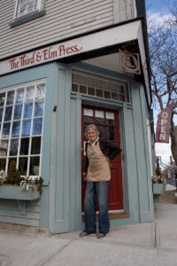CLOSE CALL: Ilse Buchert Nesbitt, a woodblock print artist, owns The Third & Elm Press print shop, which operates from a ground-level space on the corner of her house. For the more than 50 years that Nesbitt has owned the property, it has escaped flooding. She kept the water out with sandbags during Hurricane Sandy in 2012. / PBN PHOTO/KATE WHITNEY LUCEY