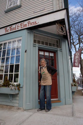 CLOSE CALL: Ilse Buchert Nesbitt, a woodblock print artist, owns The Third &amp; Elm Press print shop, which operates from a ground-level space on the corner of her house. For the more than 50 years that Nesbitt has owned the property, it has escaped flooding. She kept the water out with sandbags during Hurricane Sandy in 2012. / PBN PHOTO/KATE WHITNEY LUCEY