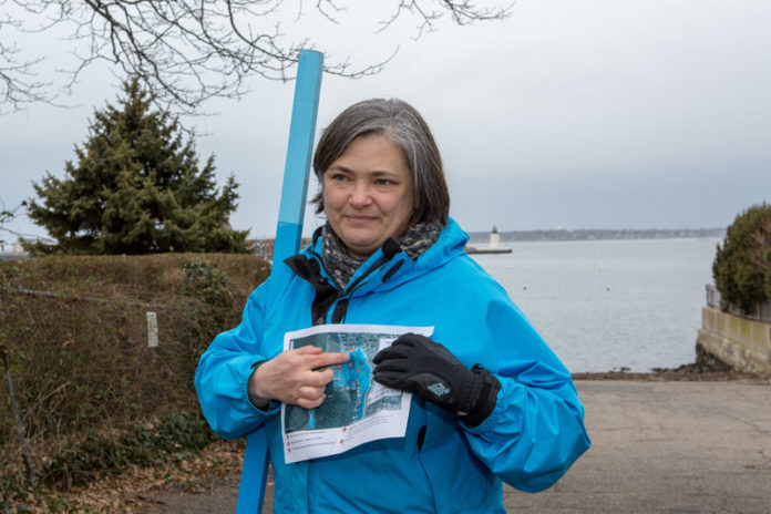 IMPERMANENCE: Teresa Crean, of the Coastal Resources Center at the University of Rhode Island, gestures to a map that shows how much of The Point neighborhood in Newport will be underwater due to sea-level rise. / PBN PHOTO/KATE WHITHEY LUCEY