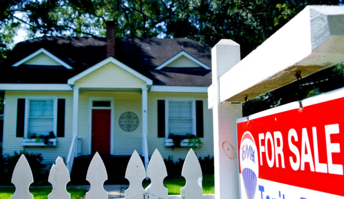 A TOTAL of 2,639 single-family homes were purchased last month in the Bay State, marking the second year in a row that the number of homes sold exceeded 2,500 in February, The Warren Group said Tuesday. / BLOOMBERG FILE PHOTO/DERICK E. HINGLE