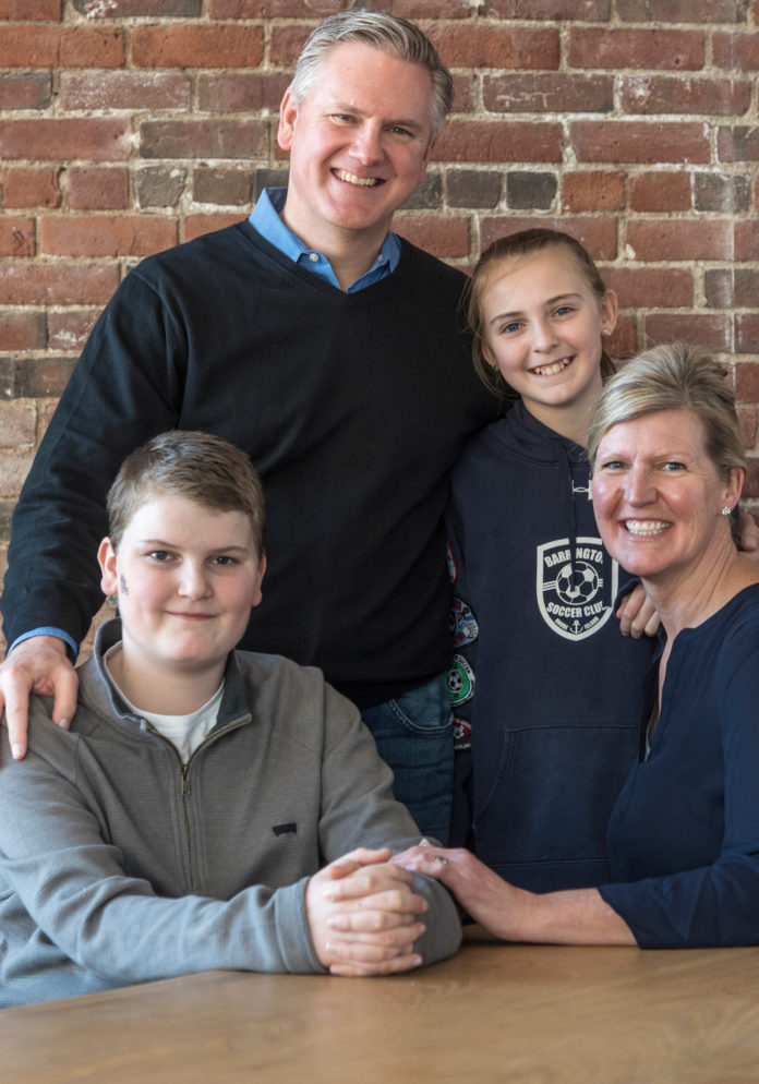 FAMILY TALK: Jarrid and Sylvia Hall with their children, Austin and Gracie. Their new startup, Dinner-x-Change LLC, is designed to help parents and children communicate. / PBN PHOTO/MICHAEL SALERNO