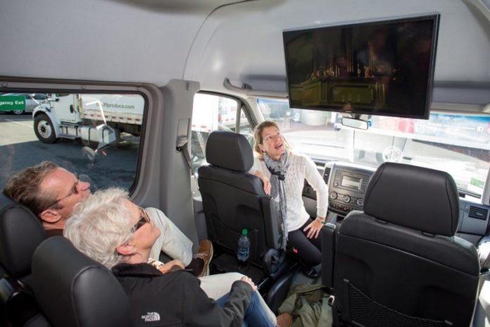 FRESH PERSPECTIVE: Newport Film Tour owner Tammy Fasano, front seat, shows movie scenes to customers before taking them to the actual locations where the scenes were filmed in Newport. / PBN PHOTO/KATE WHITNEY LUCEY