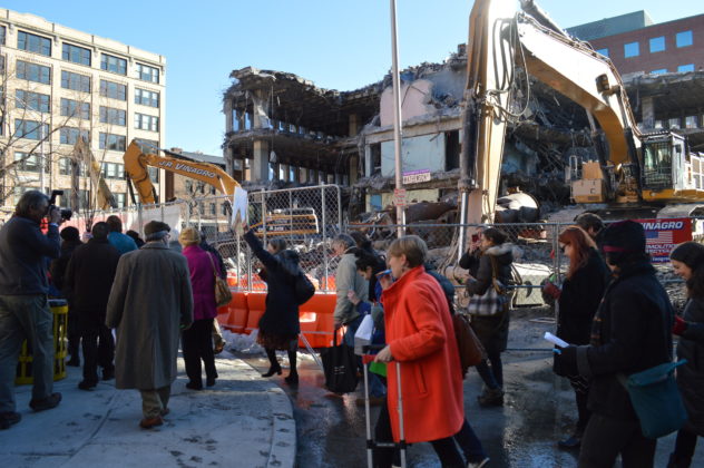 A GROUP of mourners gathered on Sabin St. March 17 to pay their final respects to the John E. Fogarty Building. Demolition on the building began this week.  / PBN PHOTO/NICOLE DOTZENROD