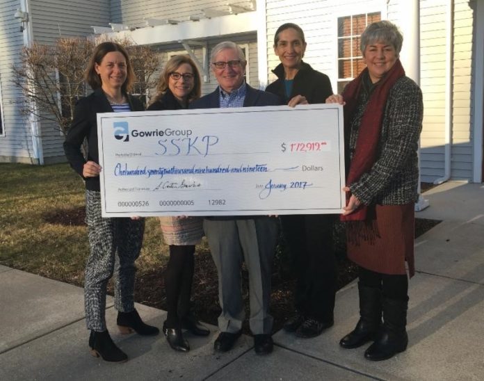 GOWRIE GROUP members Whitney Peterson, left, Lindas Dillon, second from left, and Carter Gowrie, center, give a donation check to Patty Dowling, second from right, and Claire Bellerjeau of The Shoreline Soup Kitchens & Pantries. / COURTESY GOWRIE GROUP