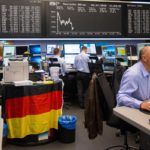 INVESTORS ARE CONSIDERING moving out of U.S. equities to European stocks, based on the assumption that the recent run-up in the United States overvalues American stocks, while Europeans stocks are seen as being under-valued. Traders at the Frankfurt Stock Exchange in Germany monitor data in this photo. / BLOOMBERG NEWS PHOTO/KRISZTIAN BOCSI