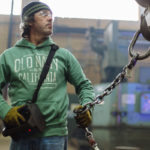 GETTING IT RIGHT: Taco Comfort Solutions burn-table operator Paul Pavao checks connections at the company's Fall River facility. Safety procedures in place have allowed the plant to go more than nine years without losing a day to work-related injury. / PBN PHOTO/RUPERT WHITELEY