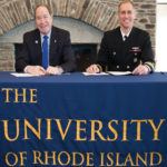 UNIVERSITY OF RHODE Island President David M. Dooley, left and Capt. Michael R. Coughlin, commanding officer at the Newport Naval Undersea Warfare Center, are shown after signing the partnership agreement. /COURTESY URI/JESSICA VESCERA