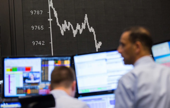 Trading Inside The Frankfurt Stock Exchange As London Stock Exchange Group Plc Shareholders Approve Deal STOCKS AND THE DOLLAR gained value early Thursday ahead of the meeting of President Donald Trump and Chinese leader Xi Jinping. Early indications are that Friday's U.S. jobs report will be a strong one as well.