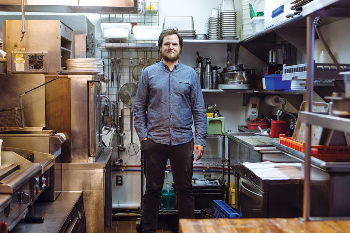 FILLING A VOID: Benjamin Sukle, pictured in his kitchen at Oberlin, says he decided to open the restaurant, his second, because he wanted a place where people could get “some slices of fish, a pasta and some really good wine,” adding, “that’s a void I think needed to be filled.” / PBN PHOTO/RUPERT WHITELEY FILLING A VOID: Benjamin Sukle, pictured in his kitchen at Oberlin, says he decided to open the restaurant, his second, because he wanted a place where people could get “some slices of fish, a pasta and some really good wine,” adding, “that’s a void I think needed to be filled.” / PBN PHOTO/RUPERT WHITELEY