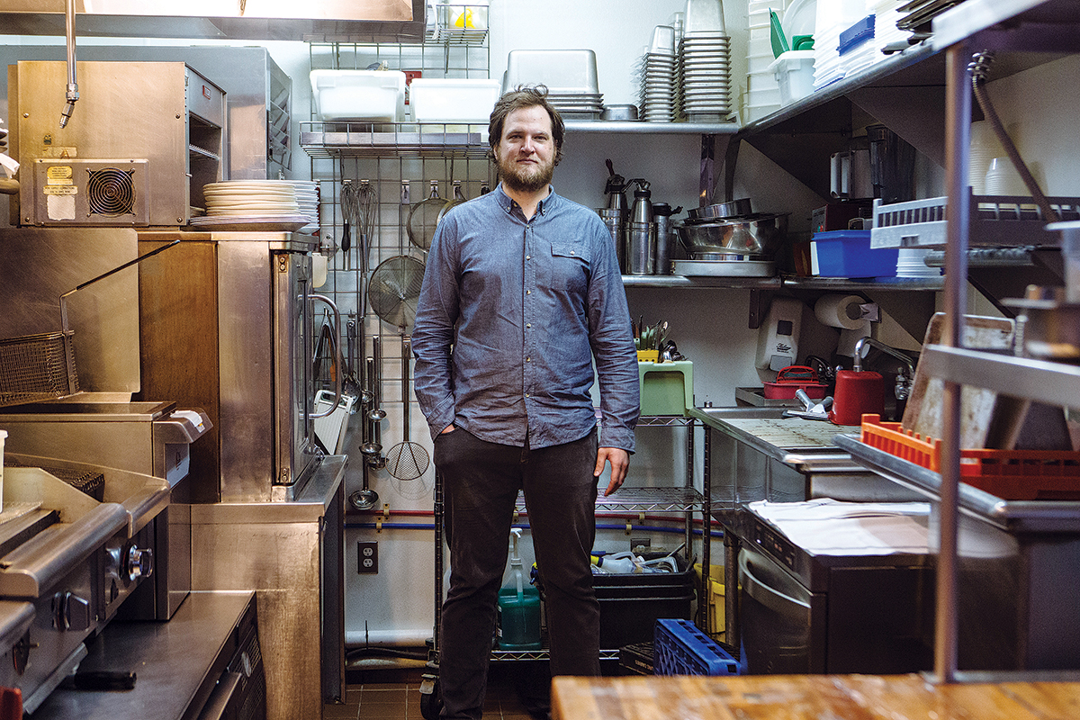 FILLING A VOID: Benjamin Sukle, pictured in his kitchen at Oberlin, says he decided to open the restaurant, his second, because he wanted a place where people could get “some slices of fish, a pasta and some really good wine,” adding, “that’s a void I think needed to be filled.” / PBN PHOTO/RUPERT WHITELEY 