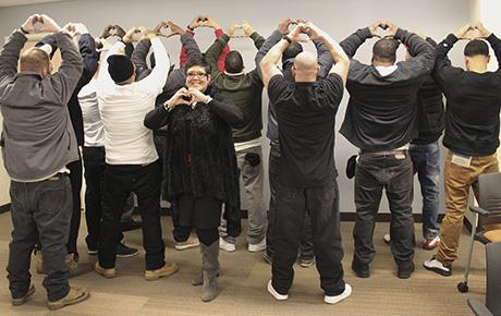 ABOVE, THE DECEMBER GRADUATES of the Pivot the Hustle Career Readiness Program of Roger Williams University with Adriana I. Dawson. The program provides contemporary workforce preparation for minimum-security inmates in work release. / COURTESY ROGER WILLIAMS UNIVERSITY SCHOOL OF CONTINUING STUDIES