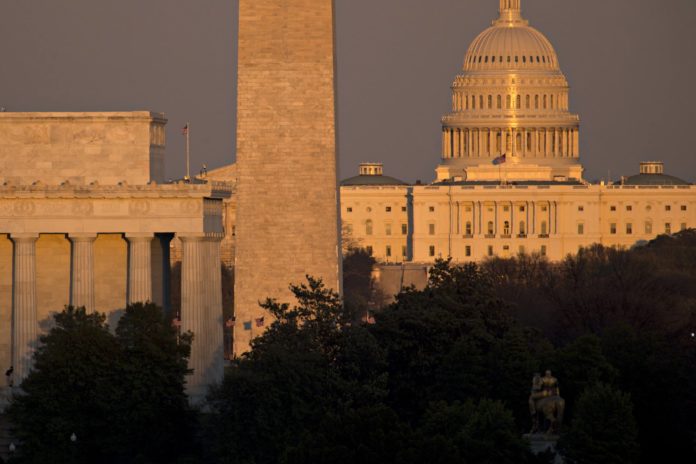 1495657336_capitol THE CONGRESSIONAL BUDGET OFFICE estimates that the GOP health plan will cut the budget deficit by $119 billion. Above: The U.S. Capitol building, from right, Washington Monument and Lincoln Memorial stand in Washington, D.C., U.S., on Wednesday, March 8, 2017. /BLOOMBERG / ANDREW HARRER