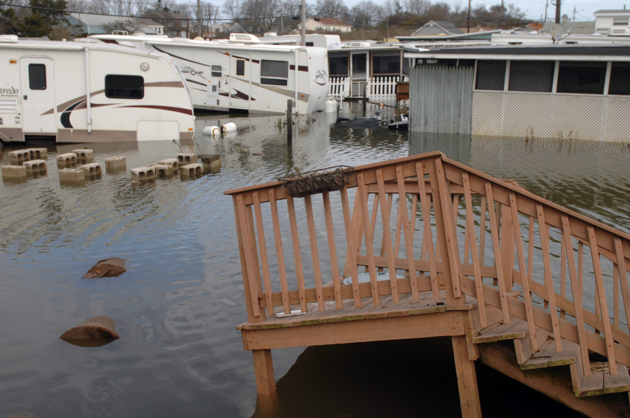 A CHANGE HAS COME: A trailer park on Matunuck Beach Road, South Kingstown, was flooded following Hurricane Sandy in 2012. Climate scientists believe that climate change is warming the planet and will result in more frequent and more powerful storms.