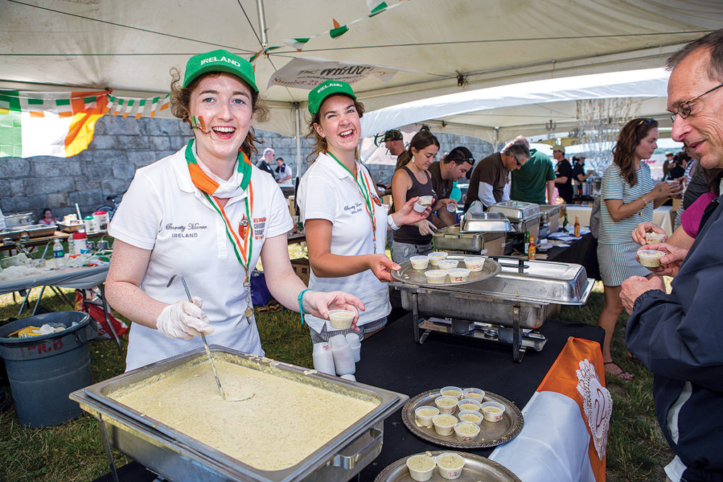 FARAWAY FLAVOR: Servers from Bunratty Manor in Ireland pass out samples of their chowder during the 2016 Great Chowder Cook-Off in Newport. / COURTESY WATERFRONT PRODUCTIONS LLC/RICK FARRELL