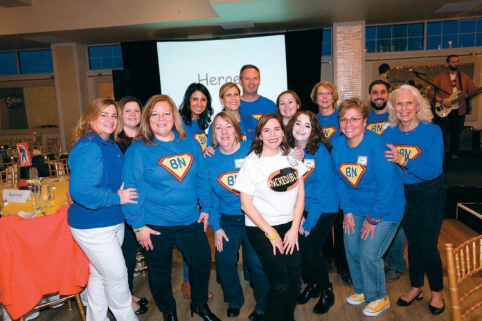 EVERYONE PITCHED IN: These BankNewport employees decorated the Atlantic Resort in Middletown for the bank’s annual sales rally. / COURTESY BANKNEWPORT