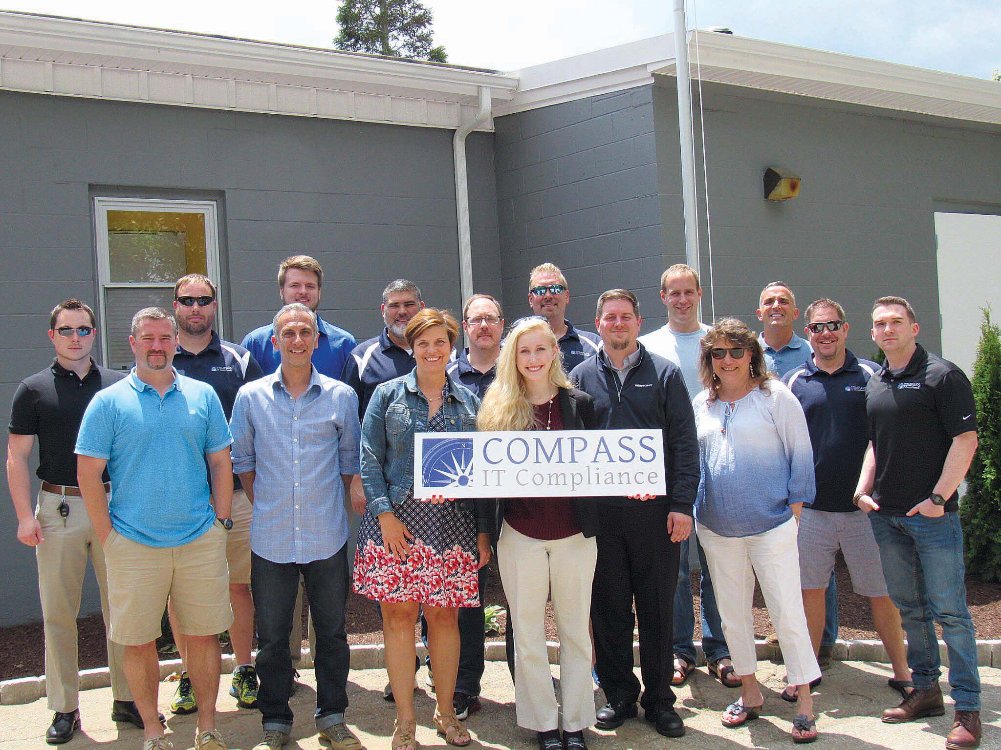 TEAM BUILDING: Compass IT Compliance makes sure that its staff, often out of town for work, gets the opportunities at the home office to connect and build the team. / COURTESY COMPASS IT COMPLIANCE