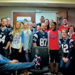 A SPIRITED WORKPLACE: Prior to the New England Patriots Super Bowl victory in February, KLR staff showed their true colors in the office. / COURTESY KAHN, LITWIN, RENZA & CO.