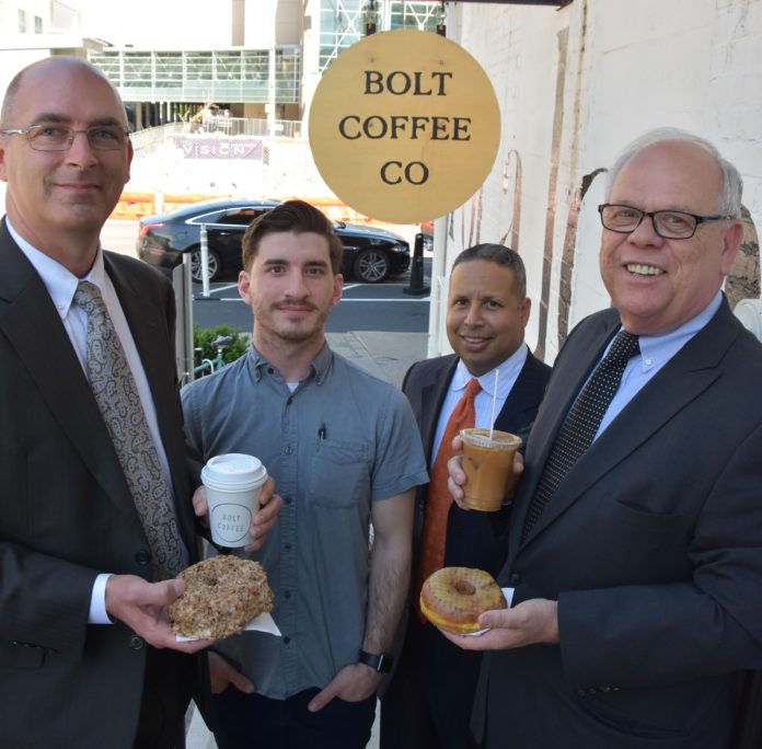 R.I. SBA members celebrate National Doughnut Day with Bolt Coffee owners and SBA loan recipients Bryan Gibb and Todd Mackey./ PHOTO COURTESY SBA