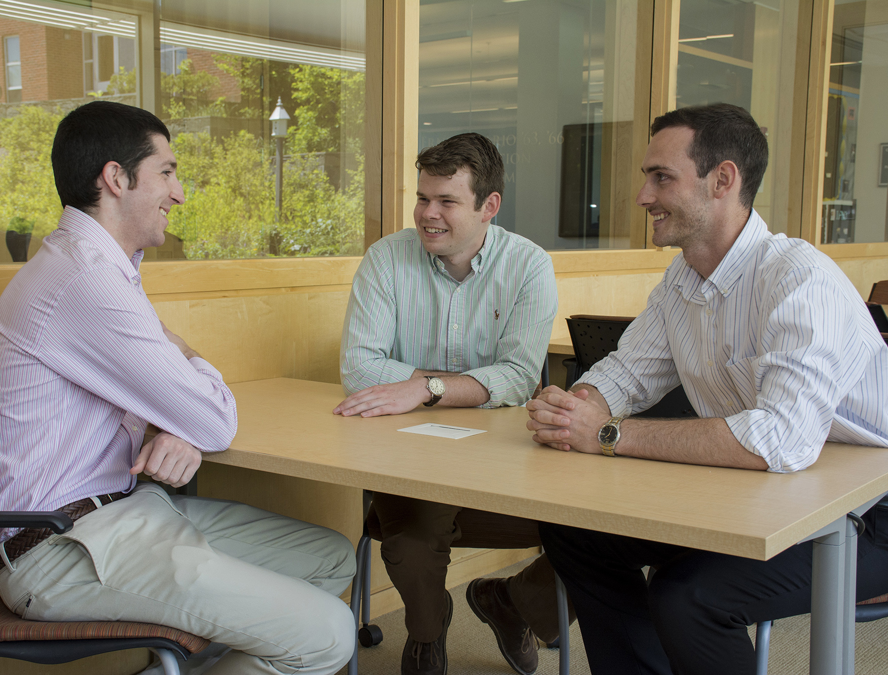 FROM LEFT, Nicholas DaSilva, Kenneth Rose and Benjamin Barlock, doctoral students at the University of Rhode Island’s College of Pharmacy, which is part of the Academic Health Collaborative, launched a drug development company, Alcinous. They discuss their venture in the pharmacy building on the Kingston Campus in early June. /COURTESY NORA LEWIS