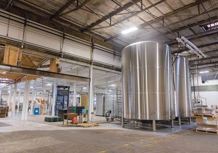 CUSTOM DESIGN: The complex is equipped with state-of-the-art, craft-brewing equipment, including a custom-designed, four-vessel automated brewing system by JVNW. / PBN PHOTO/MICHAEL SALERNO CUSTOM DESIGN: The complex is equipped with state-of-the-art, craft-brewing equipment, including a custom-designed, four-vessel automated brewing system by JVNW. / PBN PHOTO/MICHAEL SALERNO
