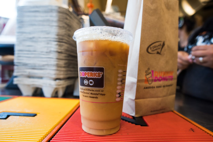 Purveyors like Dunkin’ Donuts are testing the next level of speciality for cold brew, including cups infused with nitrogen, driving up global demand for coffee beans. / BLOOMBERG FILE PHOTO /RON ANTONELLI