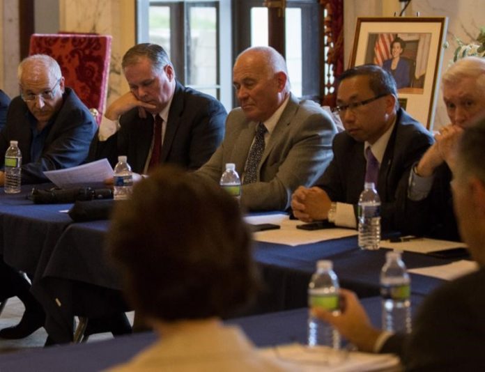 MAYORS AND TOWN managers from 25 communities in Rhode Island met with Gov. Gina M. Raimondo Thursday. From left to right, Johnston Mayor Joe Polisina, Lincoln town administrator Joe Almond, Warren town manager Jan Reitsma. Cranston Mayor Allan Fung, and Cumberland Mayor William Murray. /COURTESY THE GOVERNORS COMMUNICATIONS OFFICE