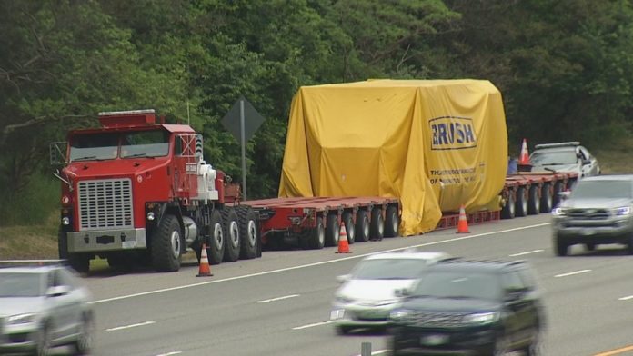 THE OPERATORS OF BAY CRANE NORTHEAST were fined $57,000 by the R.I. State Police Commercial Enforcement Unit for hauling cargo exceeding state roadway weight limits. /COURTESY WJAR-TV NBC 10