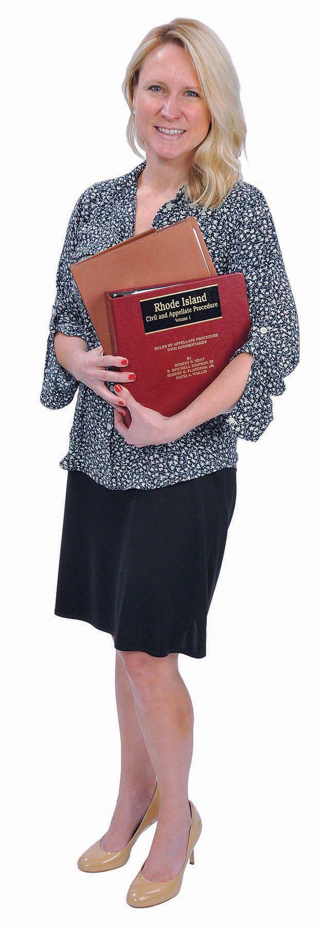 THE PROP: Sally P. McDonald seems to have a placid personality, but the law, represented by the state civil and appellate procedure manual in her hands, can bring out another side.