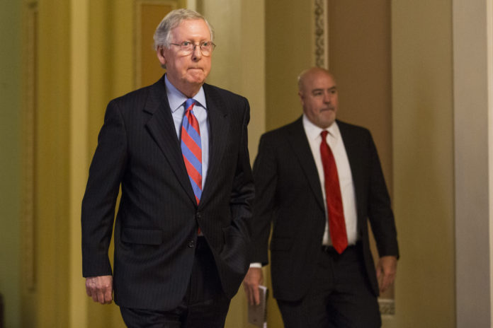 SENATE MAJORITY LEADER Mitch McConnell, a Republican from Kentucky, walks to his office from the Senate Chamber following a vote at the Capitol in Washington, D.C.