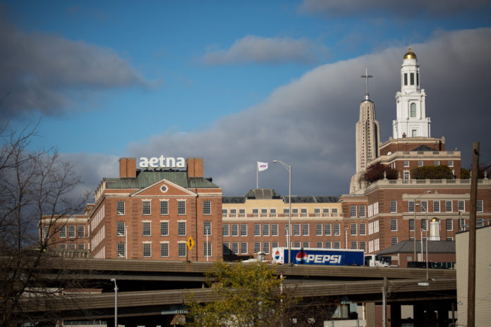 HARTFORD HIRED A restructuring firm as fiscal strains on the city build. Above, Aetna Inc. headquarters stands in Hartford, Conn. Aetna recently announced it will move its headquarters from Hartford to New York City. / BLOOMBERG FILE PHOTO/MICHAEL NAGLE
