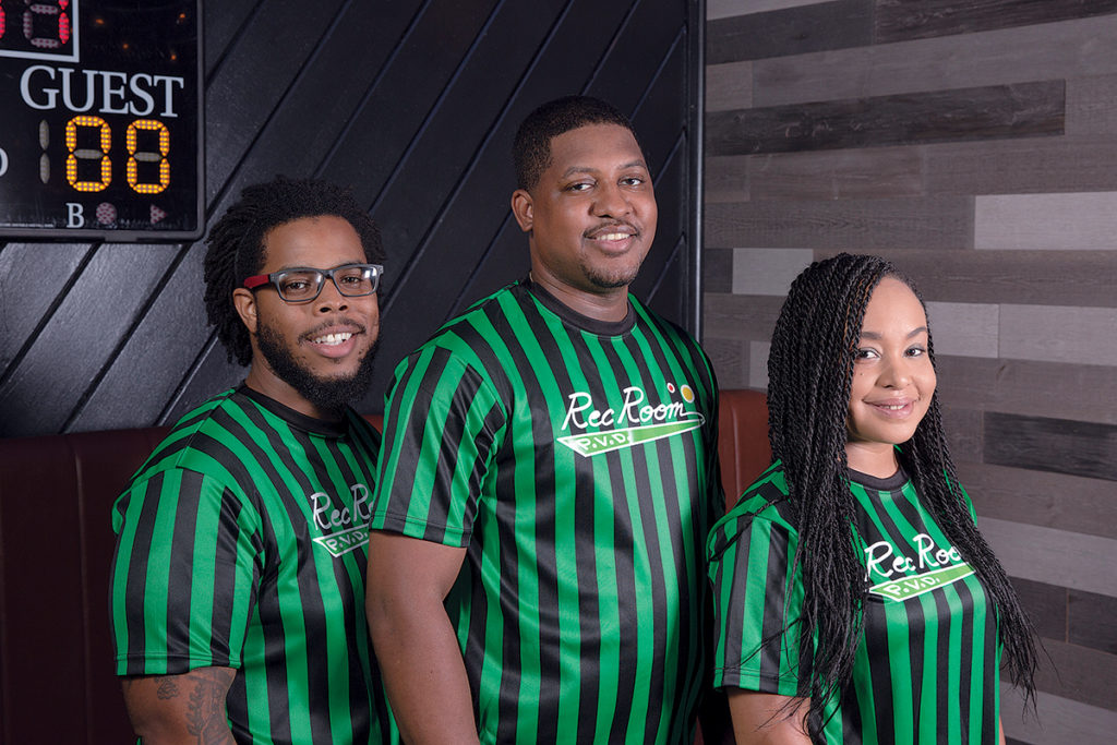 MAJOR LEAGUE DINING: Dom Hayman, left, Marvin Barksdale and Jasmine Beidleman are the owners of Rec Room PVD, a new restaurant with a ballpark theme that recently opened in Providence. / COURTESY REC ROOM PVD/JULIA SCOTT