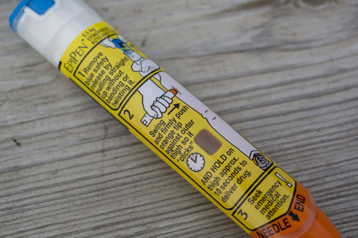 RHODE ISLAND HAS received nearly $3 million in a settlement of a U.S. case that claimed the drugmaker Mylan NV defrauded taxpayers by misclassifying its allergy-shot EpiPen product as a generic drug . /BLOOMBERG FILE PHOTO/DANIEL ACKER RHODE ISLAND HAS received nearly $3 million in a settlement of a U.S. case that claimed the drugmaker Mylan NV defrauded taxpayers by misclassifying its allergy-shot EpiPen product as a generic drug . /BLOOMBERG FILE PHOTO/DANIEL ACKER